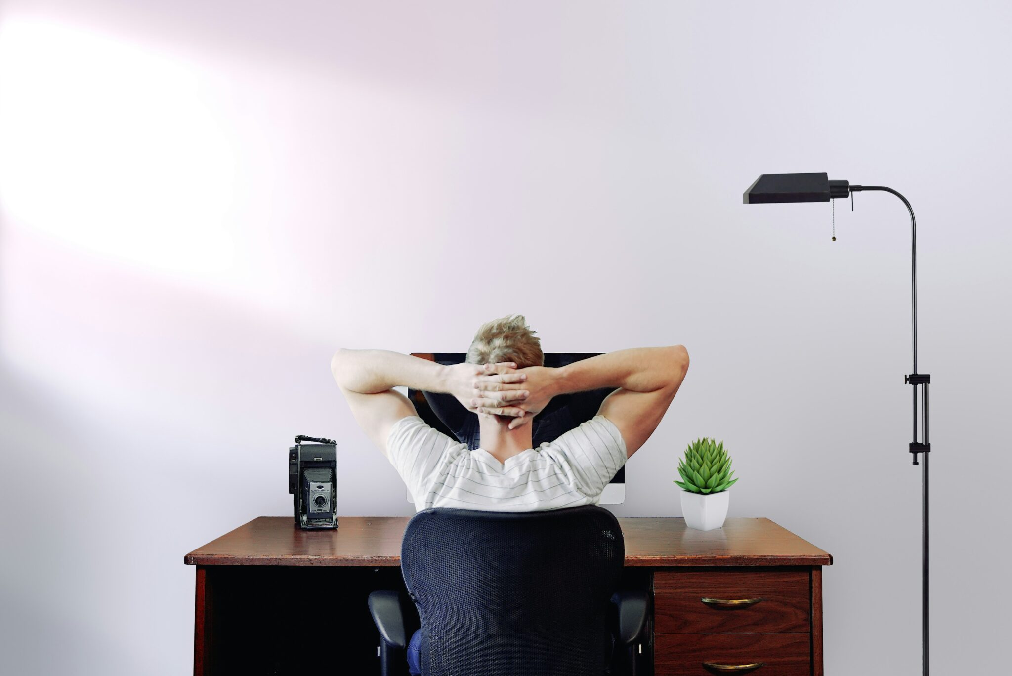 Person relaxing at desk