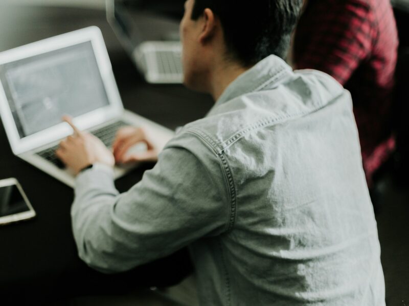 A man types at a computer