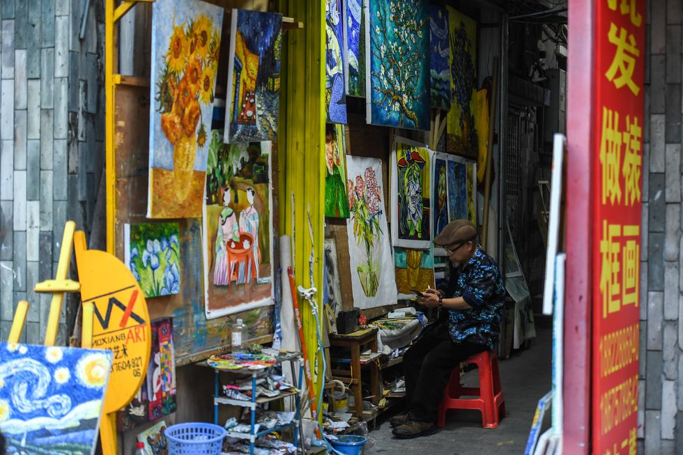 A painter copies a painting in Dafen Village
