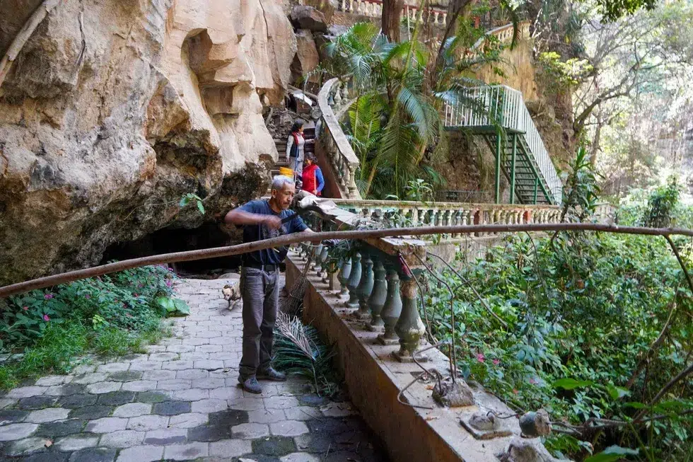 Alberto Navarro, Maricela Rodríguez, in red, and Diana Navarro clean the promenades at El Salto de San Antón waterfall in Cuernavaca.