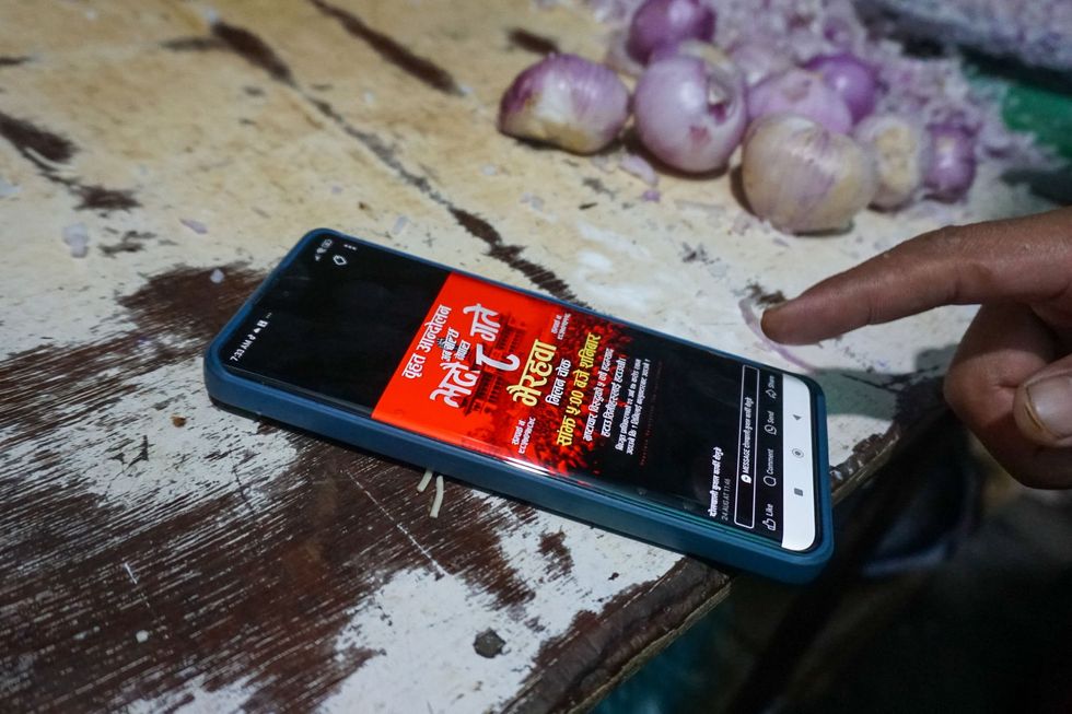 Anti-corruption Facebook post on a phone screen.
