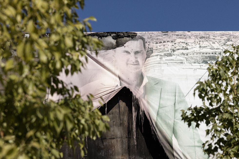 BASHAR AL-ASSAD, 59, President of Syria on a mural.