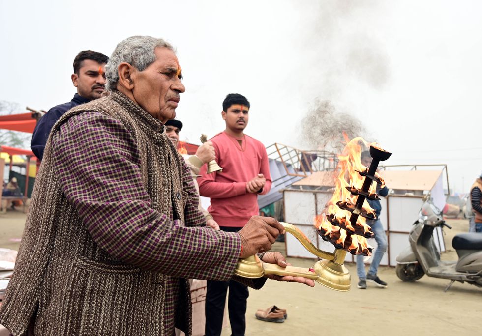 Burning sandalwood during Ganga Aarti