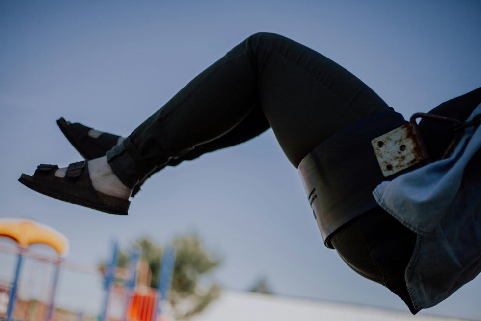 closeup photo of person raising her feet