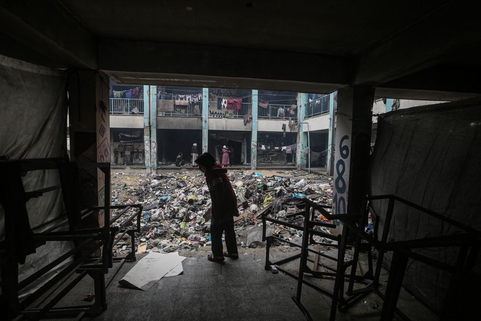 Displaced Palestinians inside a school run by the United Nations Relief and Works Agency (UNRWA) in Gaza City