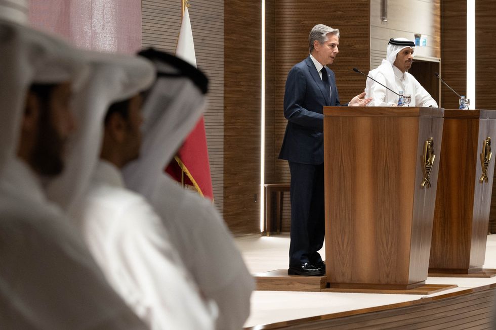 Handout photo shows Secretary Antony J. Blinken holds a joint press availability with Qatar Prime Minister and Foreign Minister Mohammed bin Abdulrahman Al Thani in Doha, Qatar