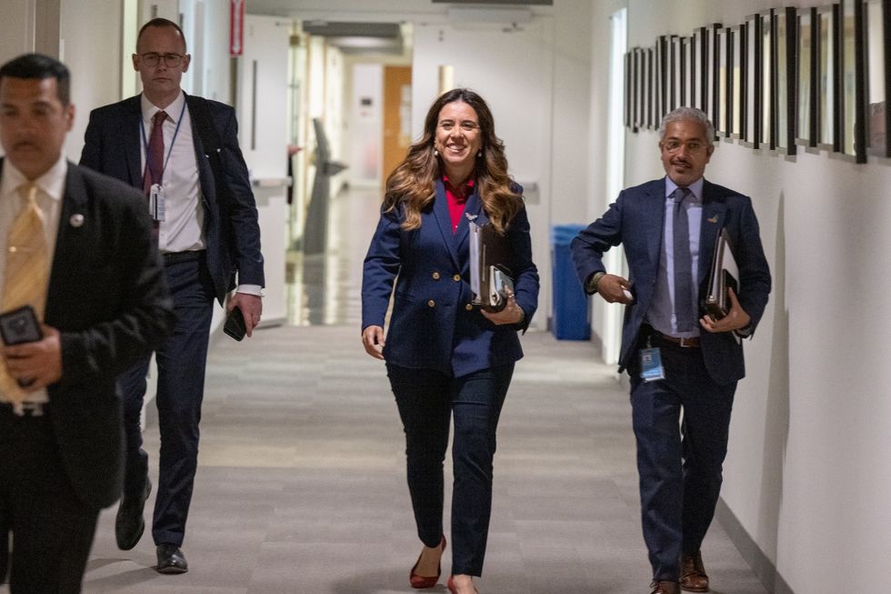 Lana Zaki Nusseibeh (2nd R), the permanent representative of the United Arab Emirates (UAE) to the United Nations, arrives at a press conference at the beginning of her country's Security Council presidency for the month of June at the UN headquarters in New York
