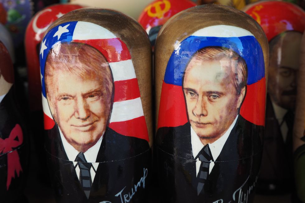 Painted Matryoshka dolls also known as Russian nesting dolls, bearing the faces of Russian President Vladimir Putin and USA President Donald Trump on display in a souvenir shop in St. Petersburg, Russia, on May 31, 2020.