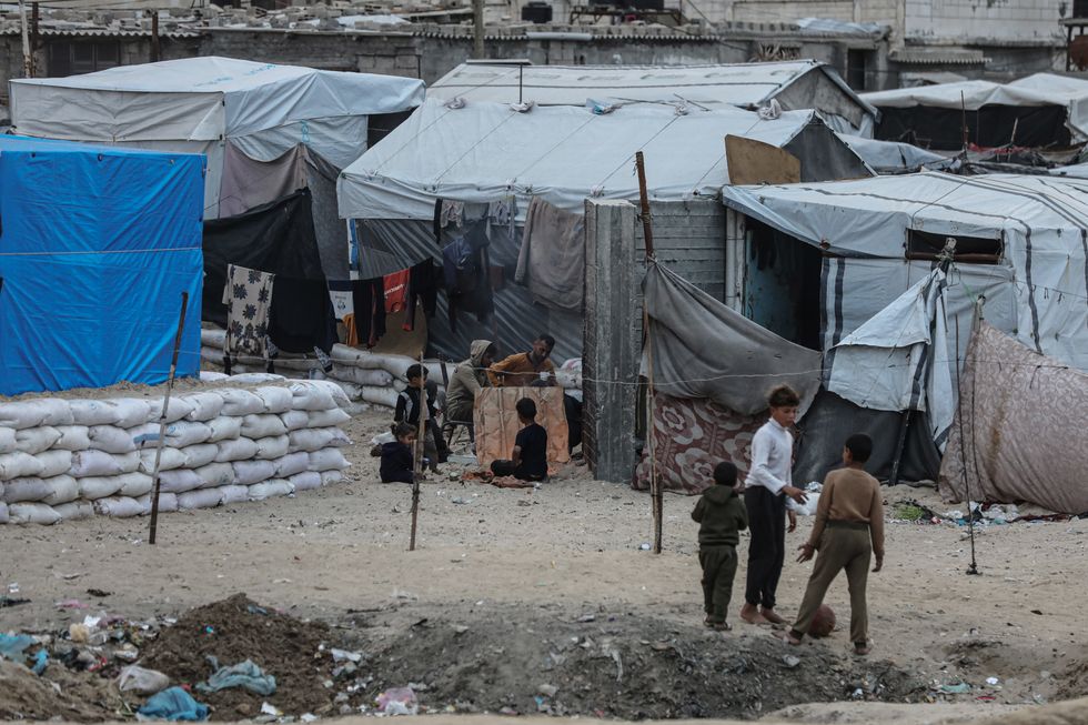 Palestinians in displacement camps try to survive with limited means in makeshift tents amid the ongoing Israeli offensive after a ceasefire agreement in Gaza between Hamas and Israel on January 22