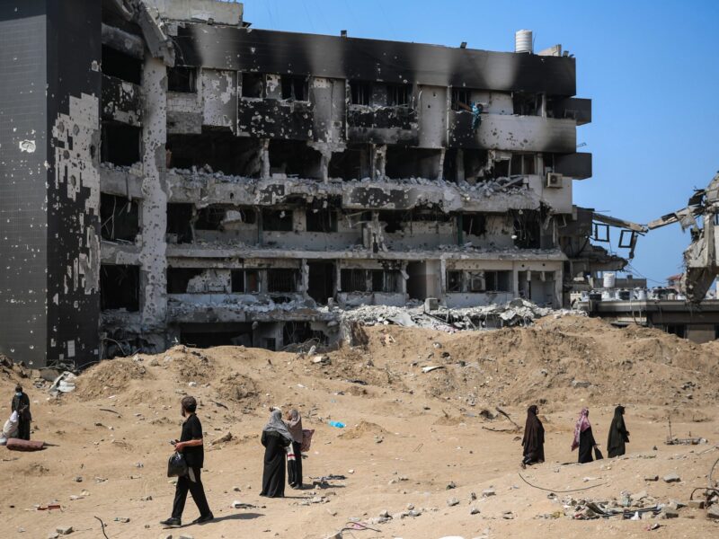 Palestinians inspect the damage at al-Shifa Hospital complex, following a two-week military operation by the Israeli army in Gaza City