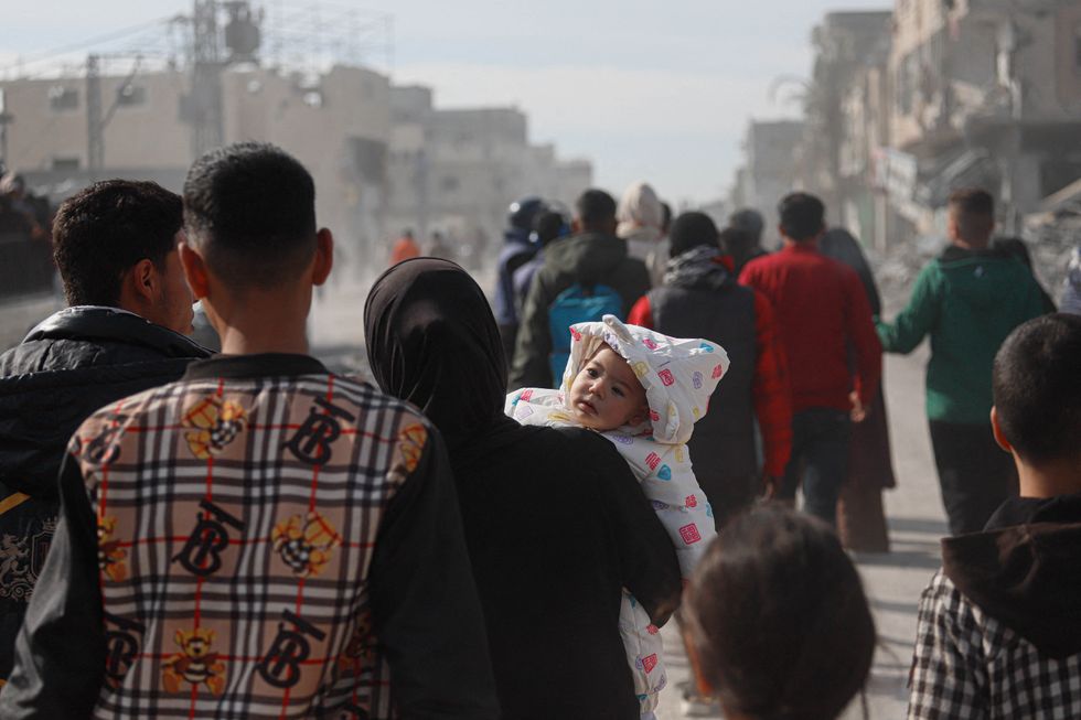 Palestinians return to the southern Gaza Strip city of Rafah on January 19, 2025