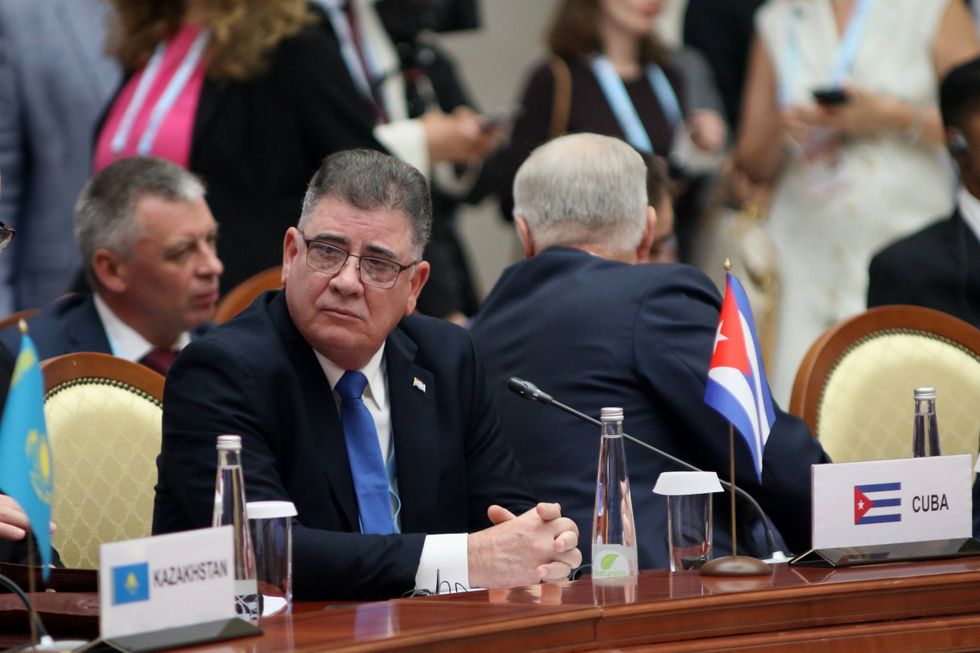 photo of a man with a small cuban flag
