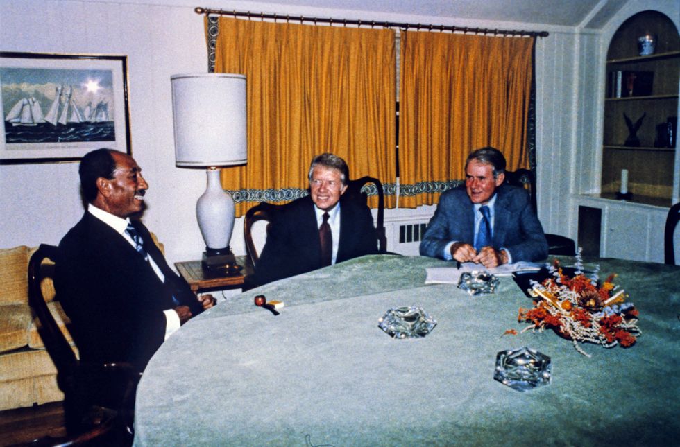 Photo of ​President Anwar al-Sadat of Egypt, United States President Jimmy Carter and U.S. Secretary of State Cyrus Vance at Camp David in 1978