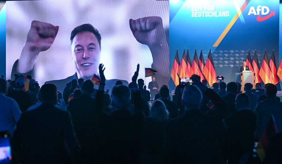 Photo of Elon Musk talking via video call with Alice Weidel, leader of AfD, during a party meeting in Halle, Germany, on Jan. 25