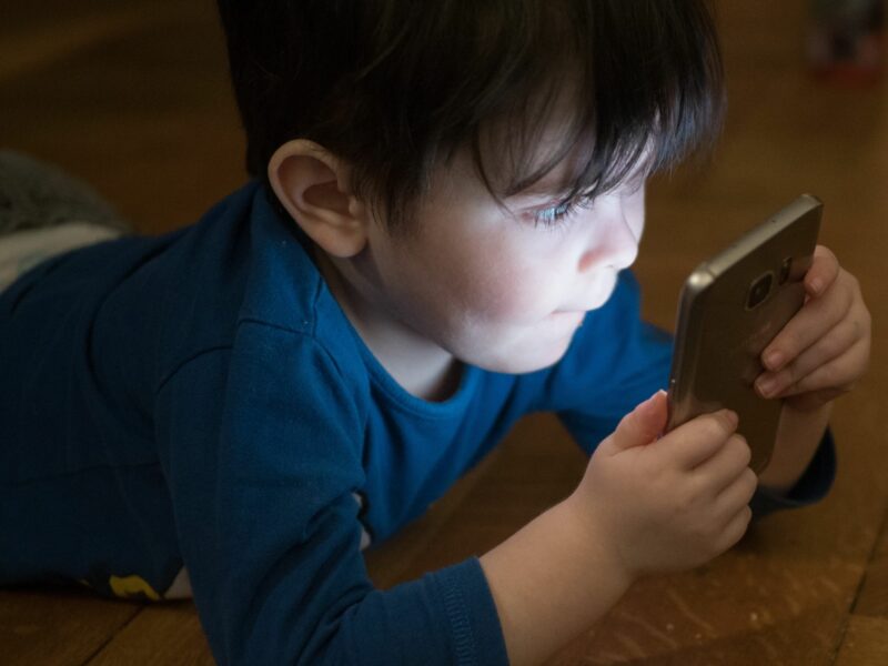 photo of kid with smartphone