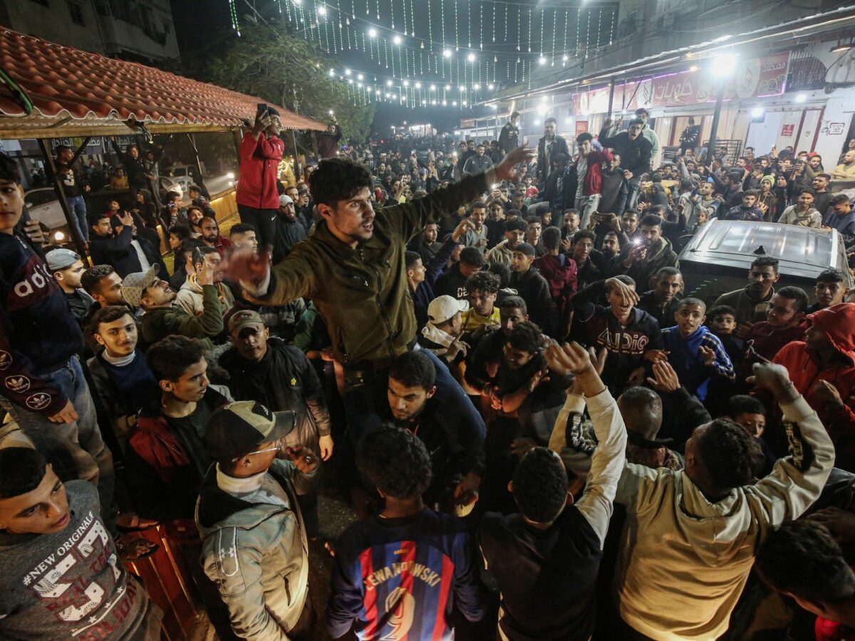 Photo of Palestinians rejoicing at news of a ceasefire agreement with Israel, in Deir al Balah, central Gaza, on Jan. 15