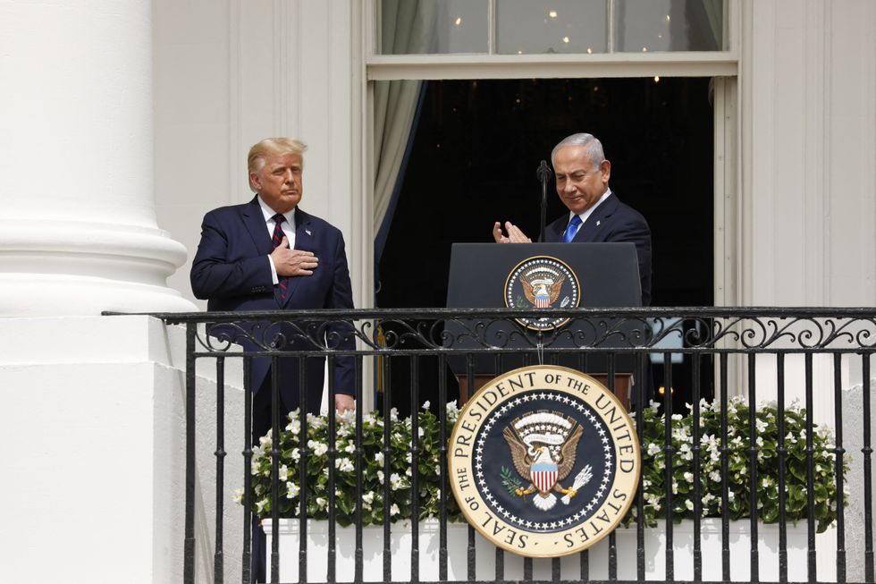 Photo of U.S. President Trump standing next to Israeli Prime Minister Benjamin Netanyahu at the signing ceremony of the Abraham Accords in 2020.