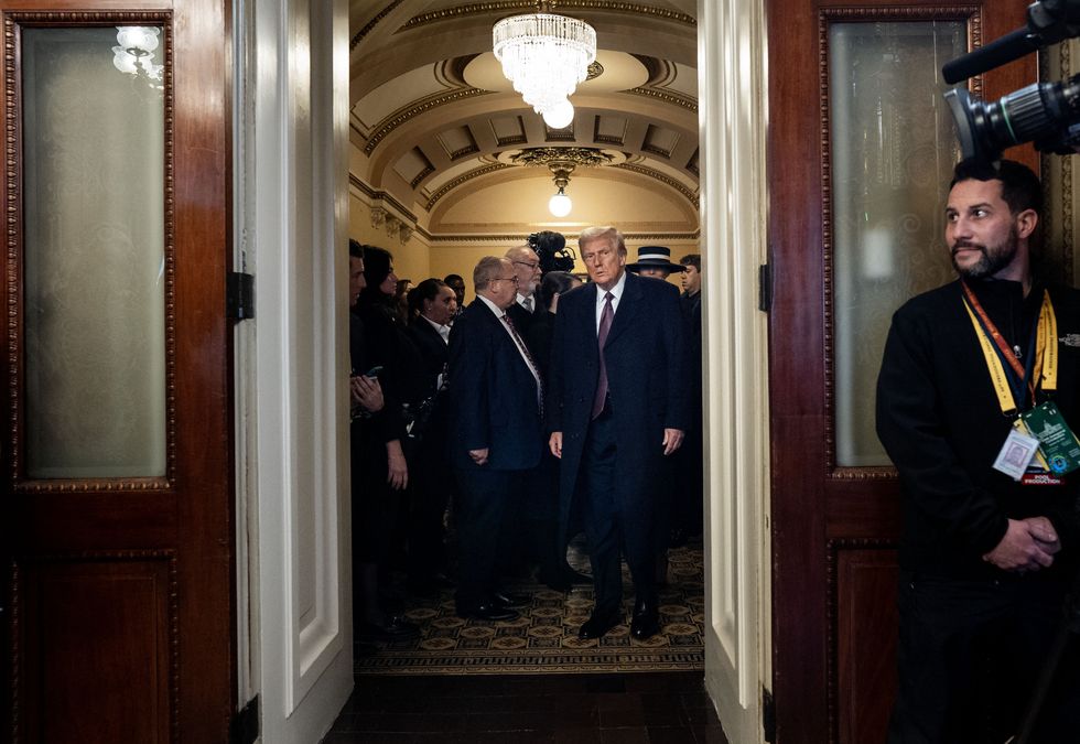 President Donald Trump enters the President's Room to sign official documents after being sworn in as the 47th president of the United States during the 60th inaugural ceremony on January 20, 2025