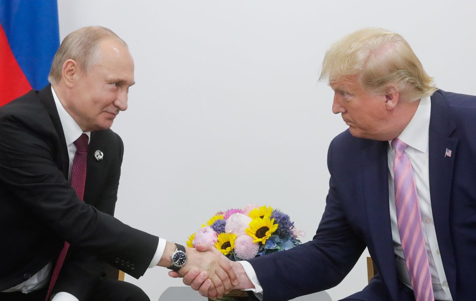 Russian president Vladimir Putin and U.S. President Donald Trump shake hand during a meeting in Osaka, Japan, in 2019.