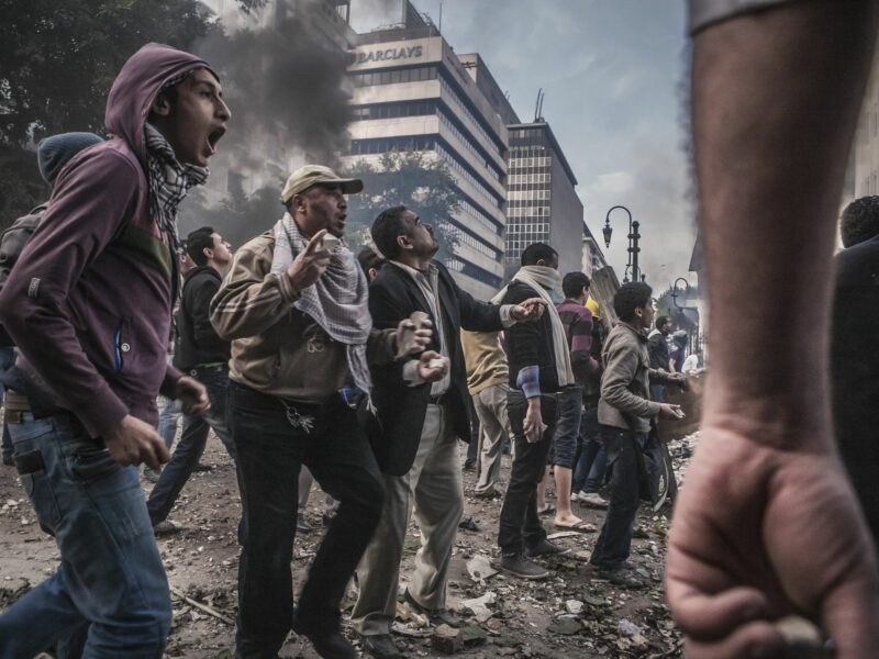 Stones are thrown during clashes between army soldiers and protesters on Al-Qasr Al-Aini Street