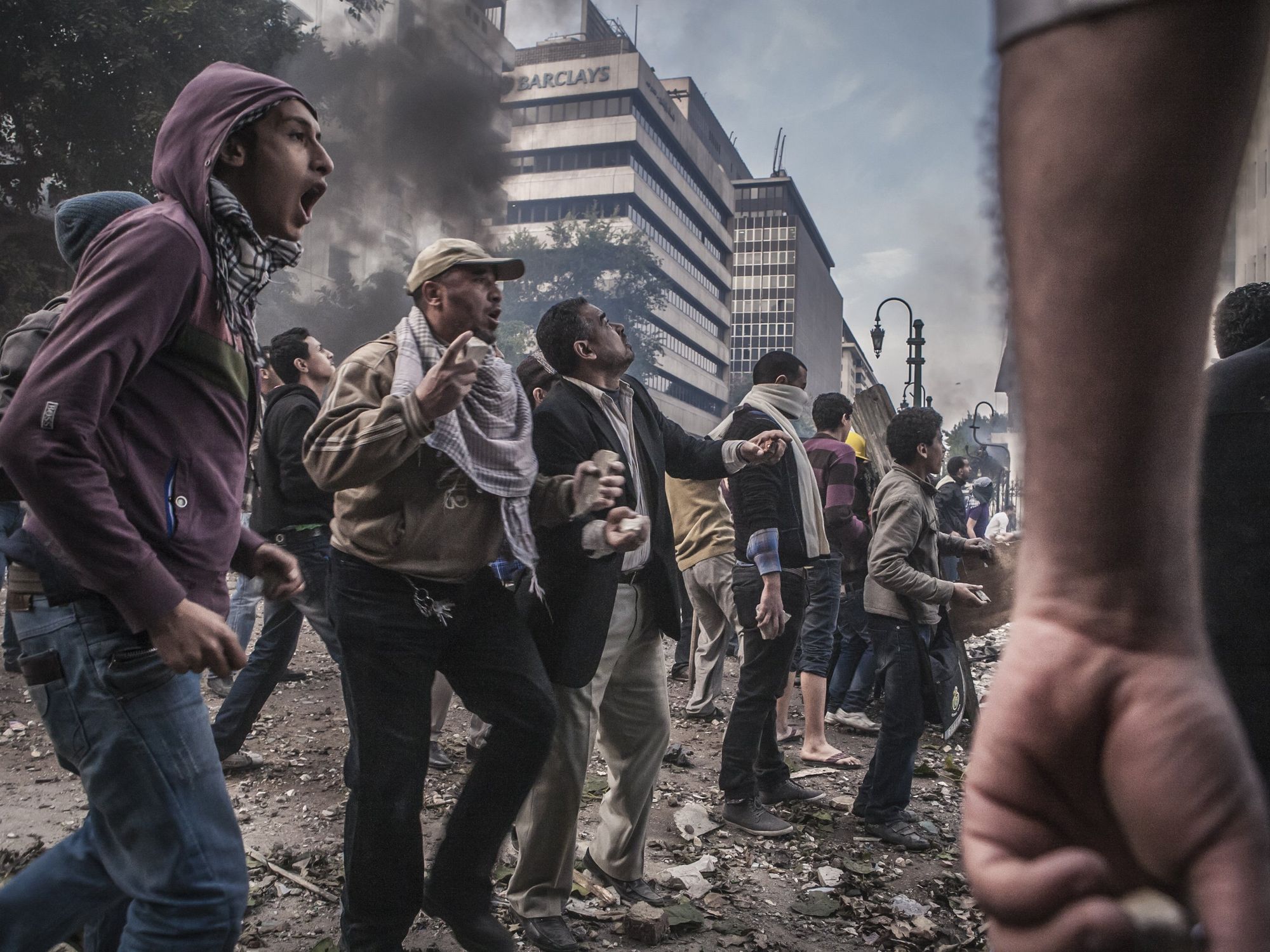 Stones are thrown during clashes between army soldiers and protesters on Al-Qasr Al-Aini Street