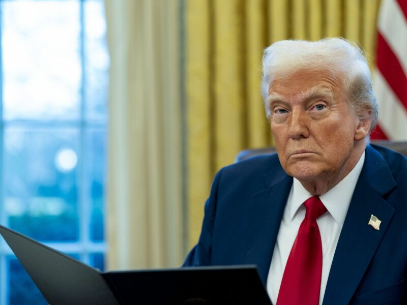 United States President Donald Trump signs two executive orders in the Oval Office of the White House in Washington, DC