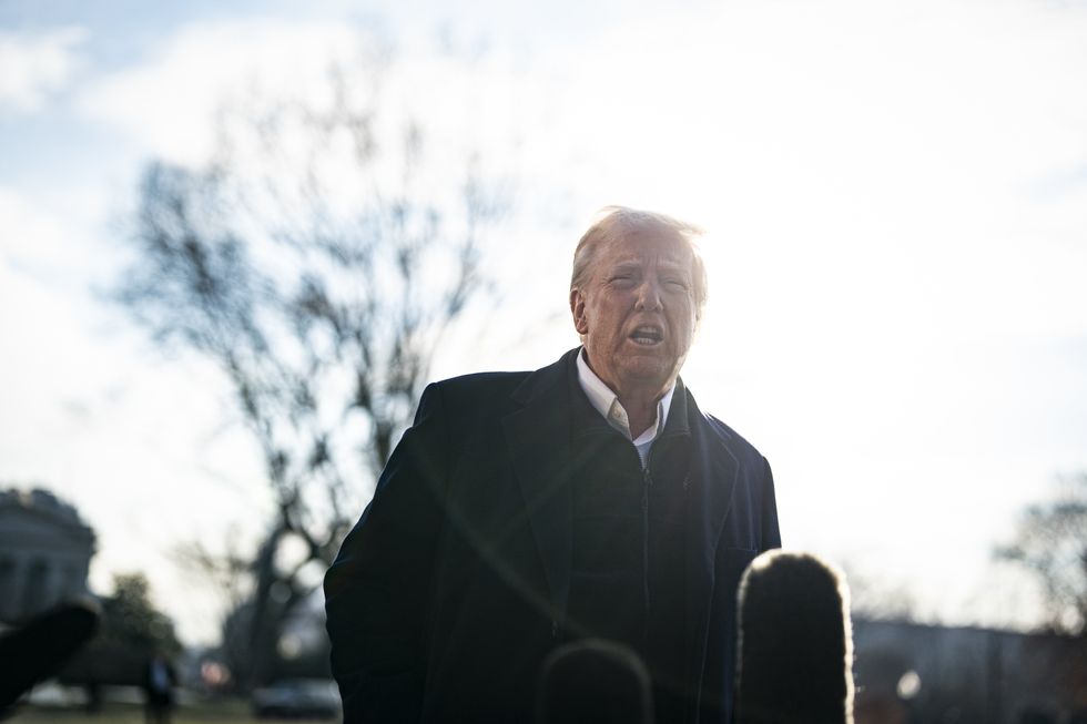 United States President Donald Trump speaks to members of the media on the South Lawn of the White House before boarding Marine One in Washington, DC, US, on Friday, Jan. 24, 2025.