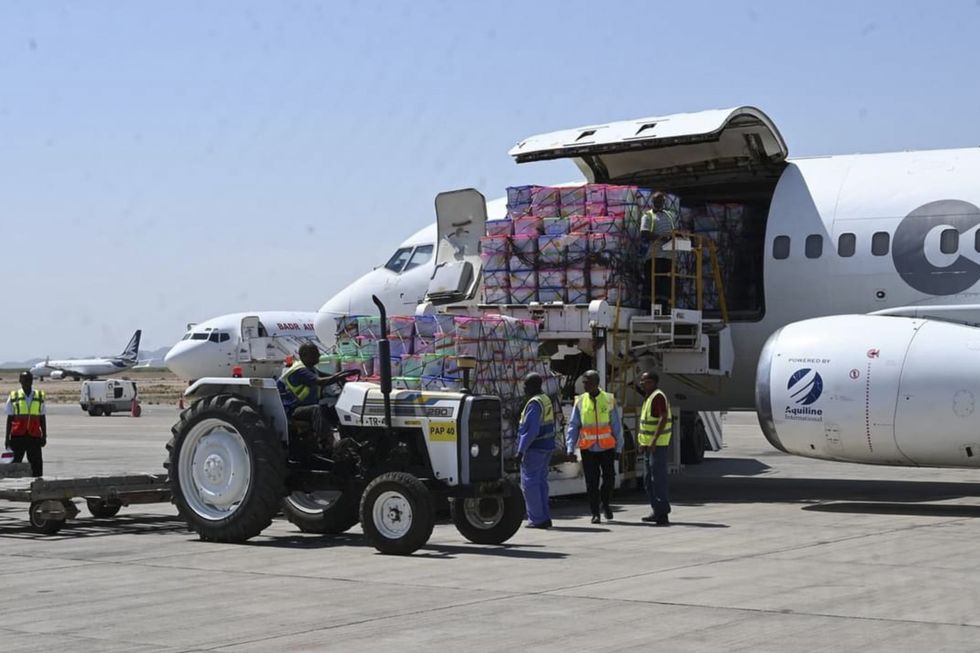 Workers unload humanitarian aid at the airport of Port Sudan in eastern Sudan.