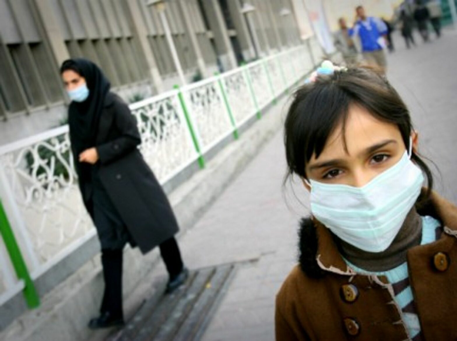 2010 An Iranian girl wears a mask on a street in Teheran