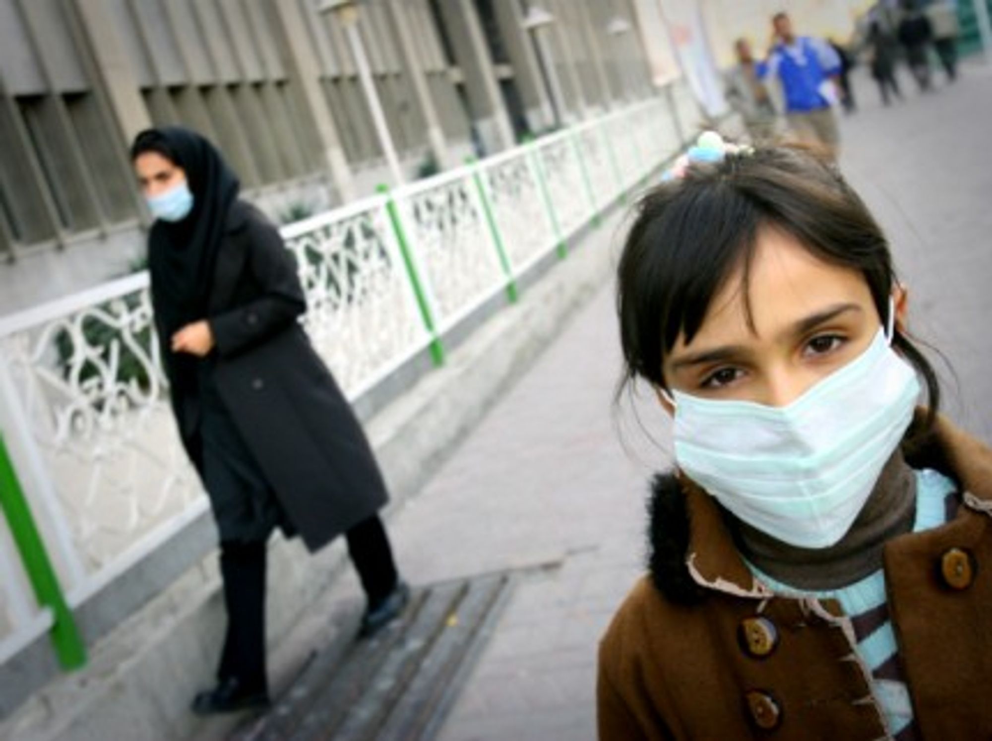 2010 An Iranian girl wears a mask on a street in Teheran