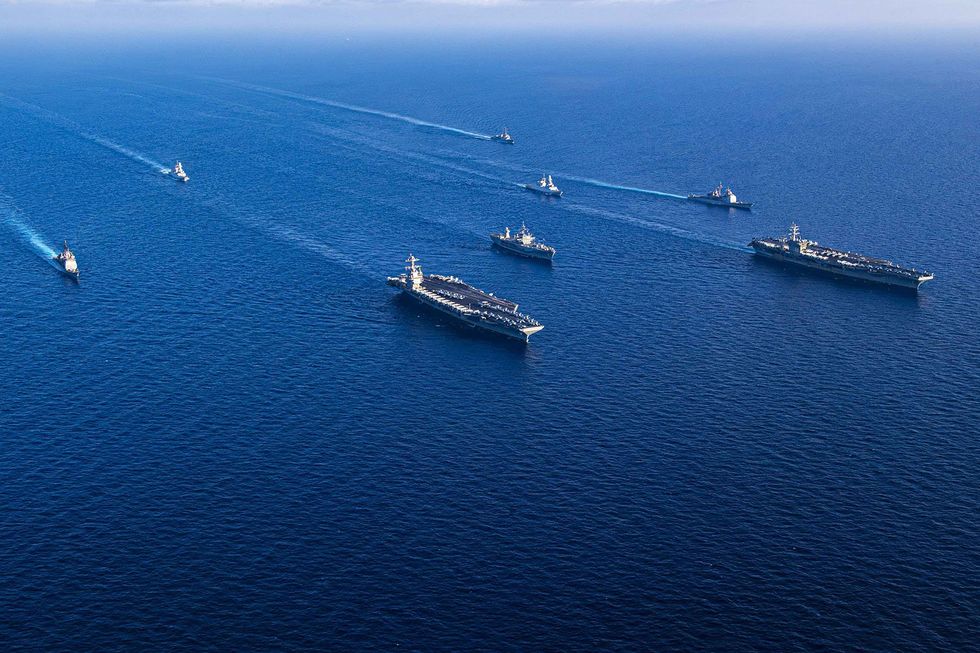 8 Ship sailing in fomration of the Mediterranean Sea.