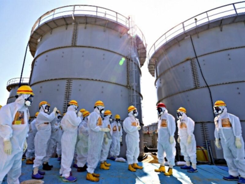 A 2013 visit to Fukushima by Japanese PM Shinzo Abe (in red helmet)