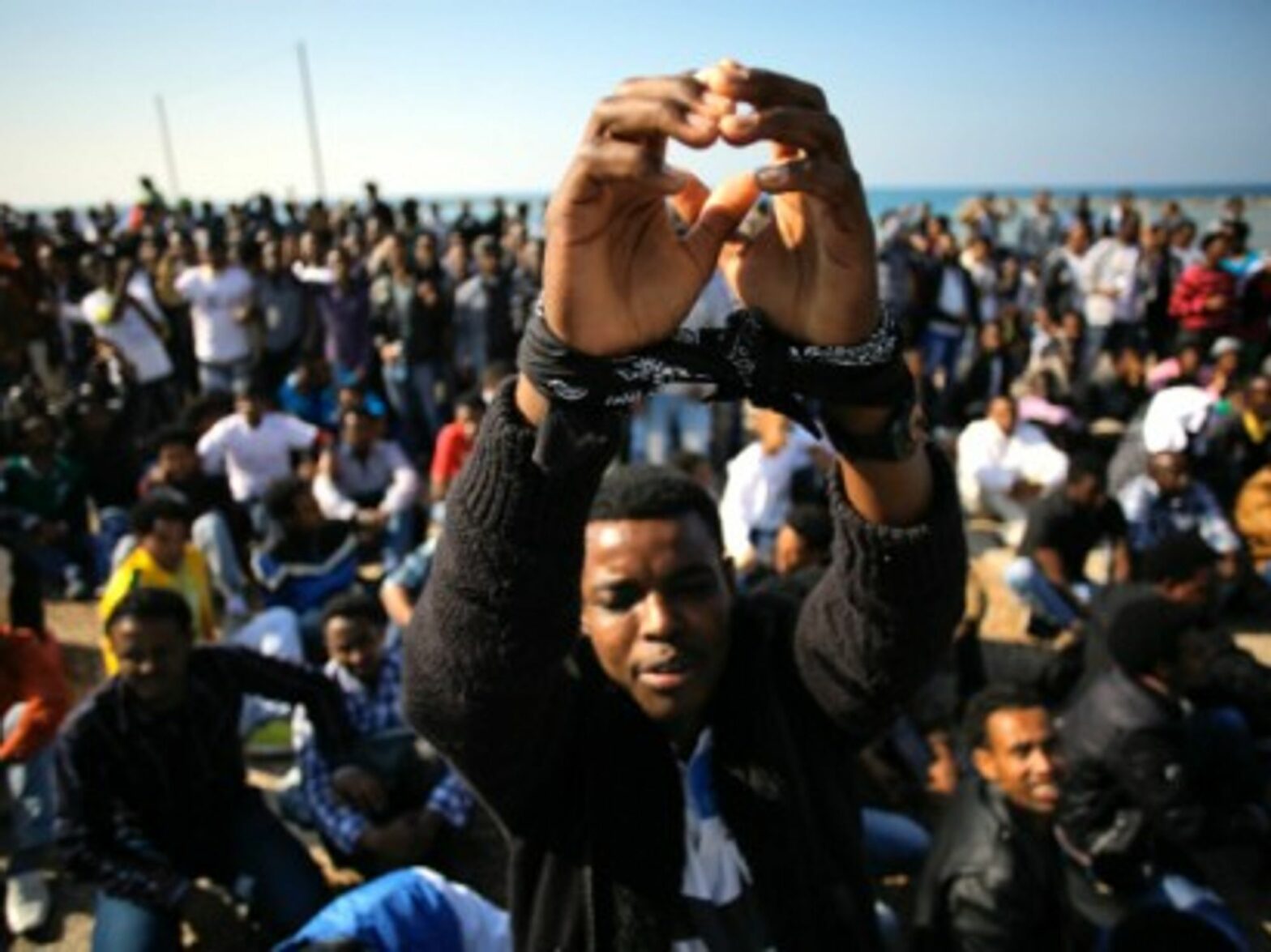 A 2014 protest in Tel Aviv, as immigrants demand asylum .