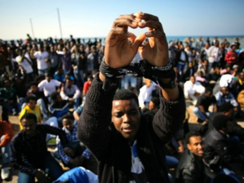 A 2014 protest in Tel Aviv, as immigrants demand asylum .