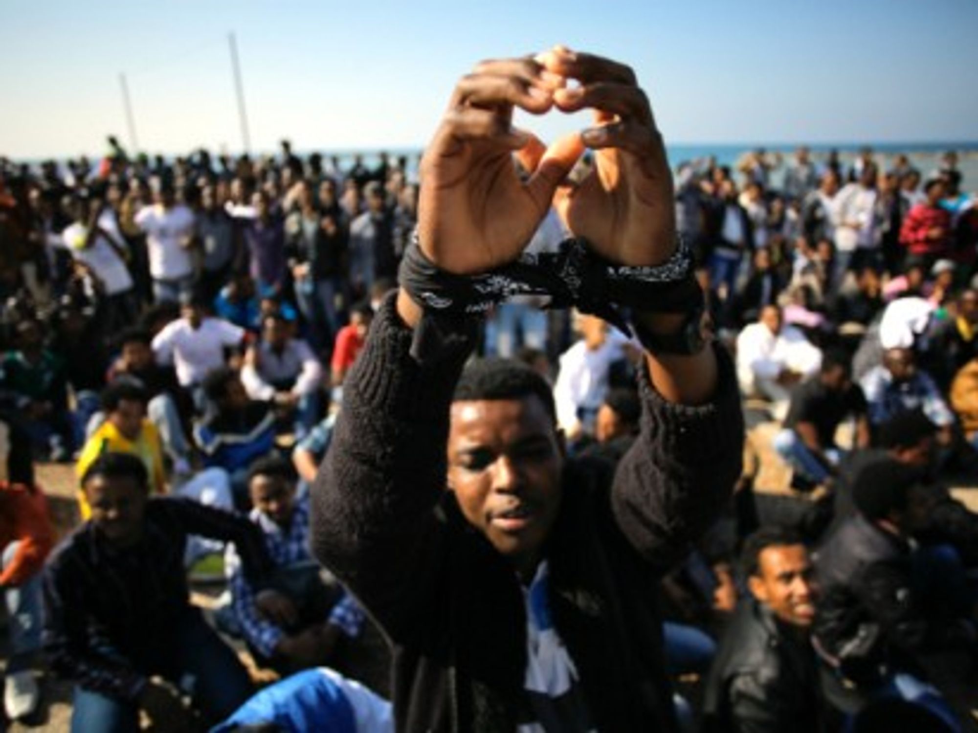 A 2014 protest in Tel Aviv, as immigrants demand asylum .