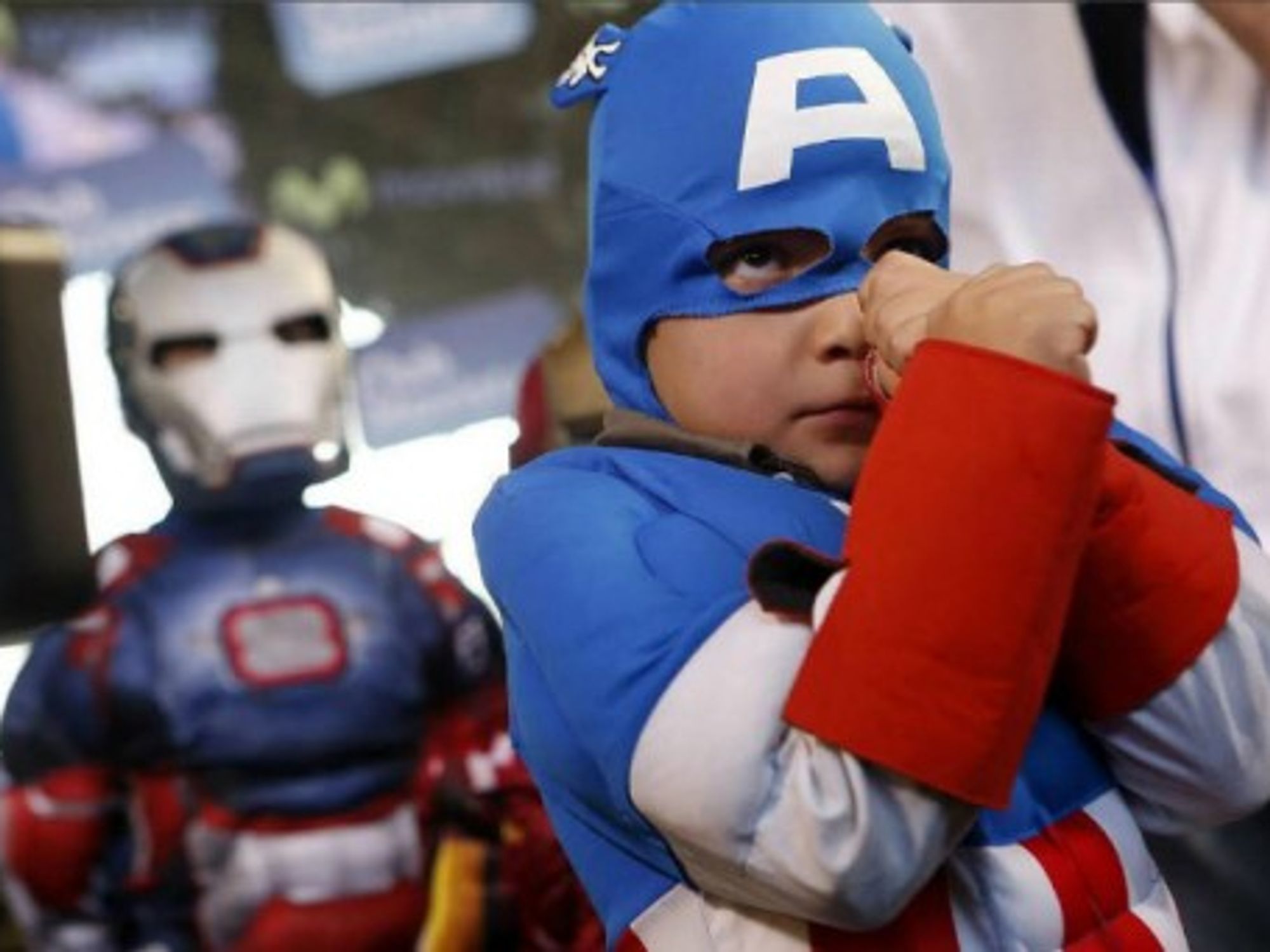 A boy dressed as Captain America strikes a pose at the fourth annual Comic Con Chile in Santiago.