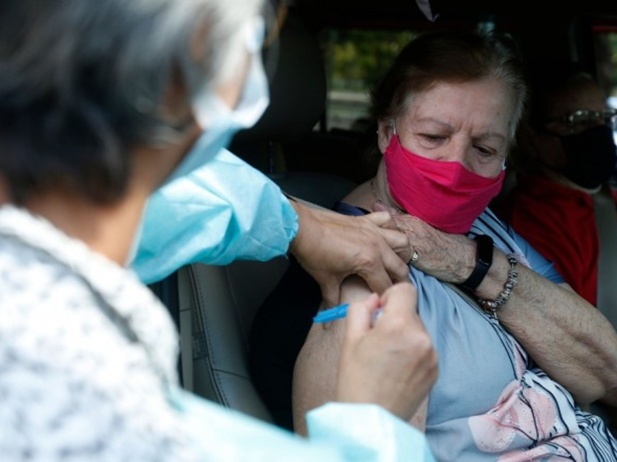 A Brazilian woman gets the Chinese-made CoronaVac vaccine.