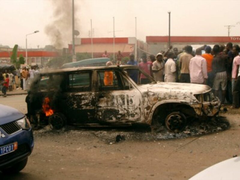 A burned out car in Abidjan earlier this year