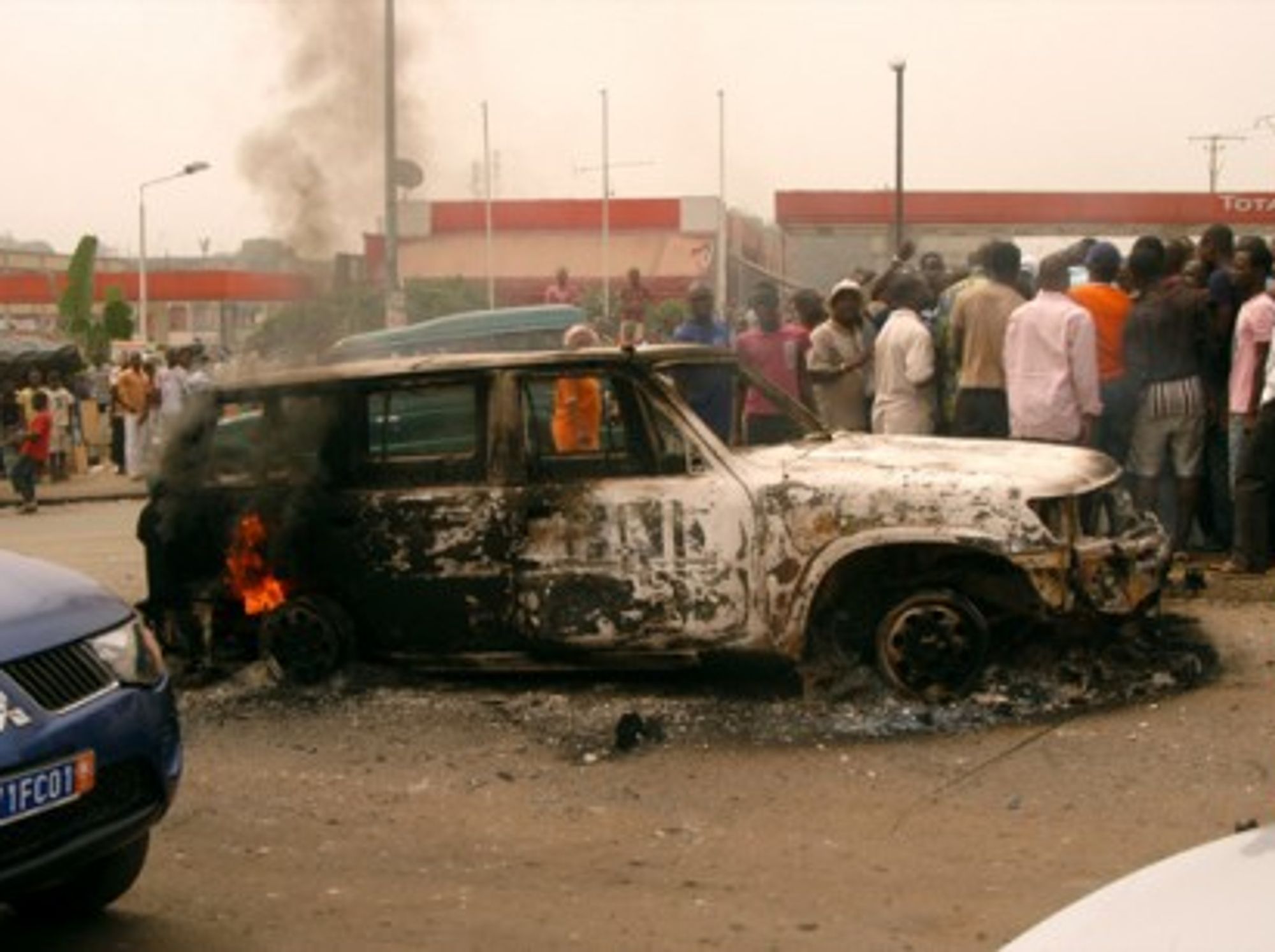 A burned out car in Abidjan earlier this year