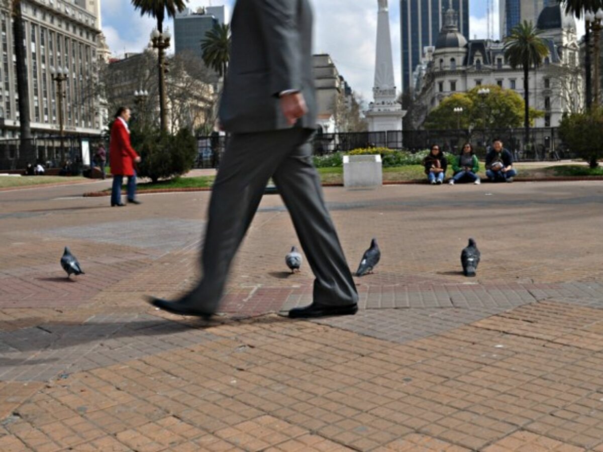 A businessman walks in Buenos Aires.