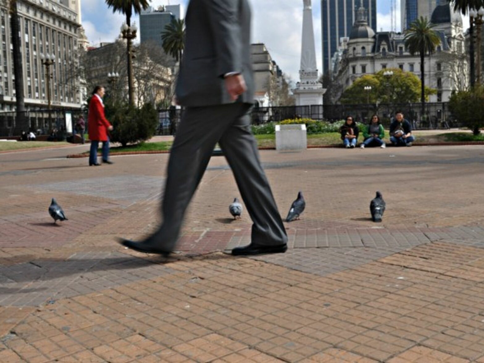 A businessman walks in Buenos Aires.