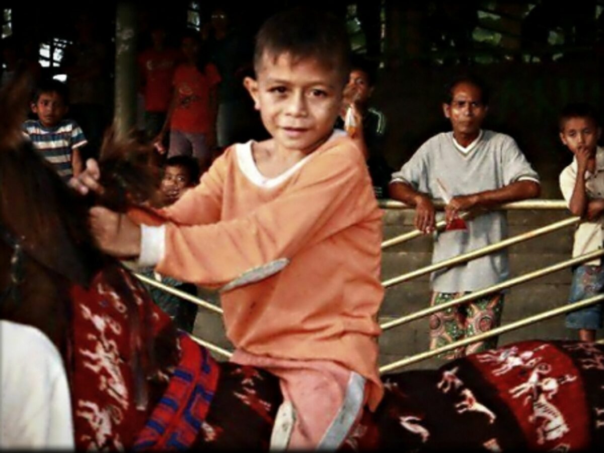 A child jockey in Indonesia