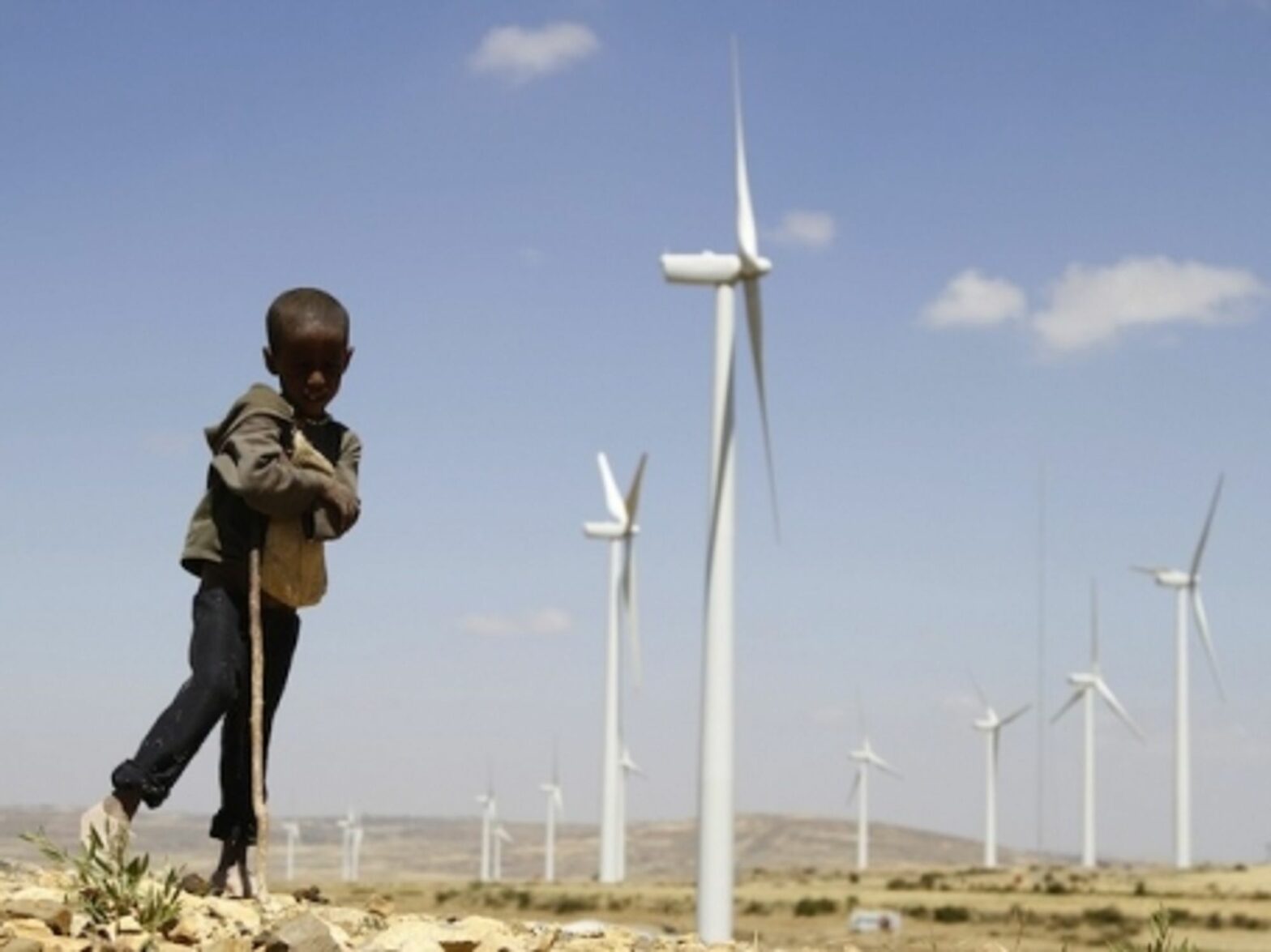 A child rests near Ashegoda Wind farm, northern Ethiopia
