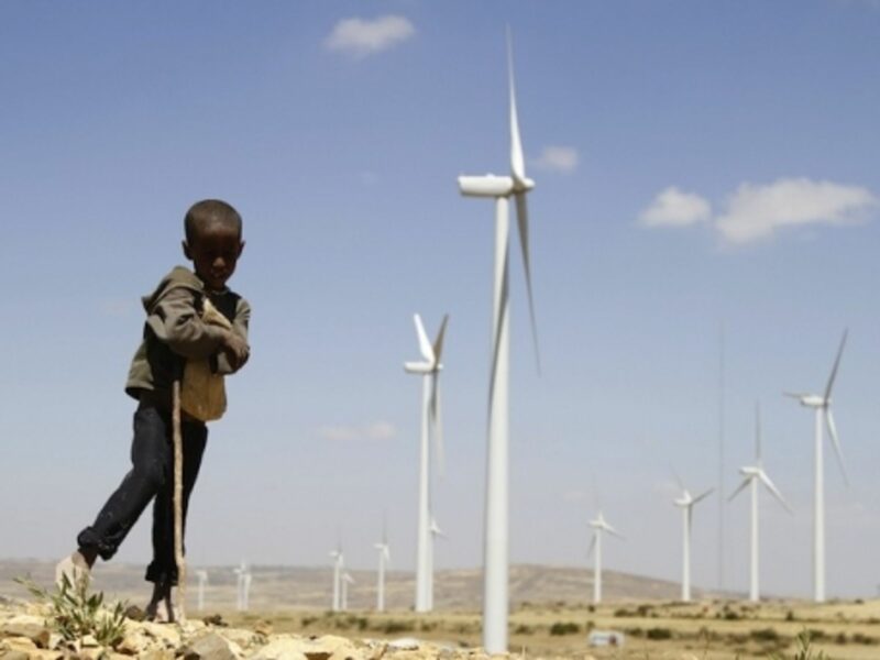A child rests near Ashegoda Wind farm, northern Ethiopia