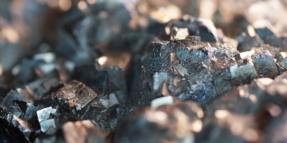 A close up image of raw lithium and graphite.