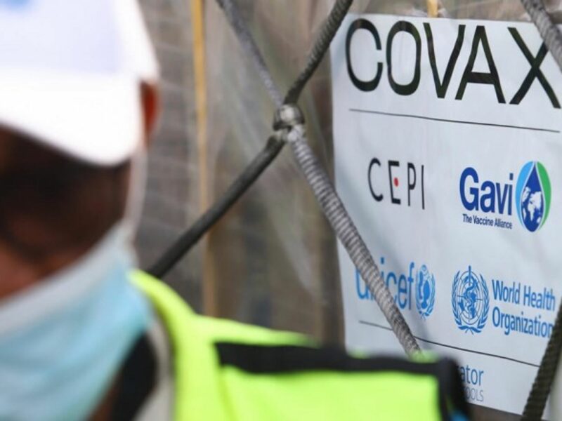A COVAX sign indicating a vaccine facility