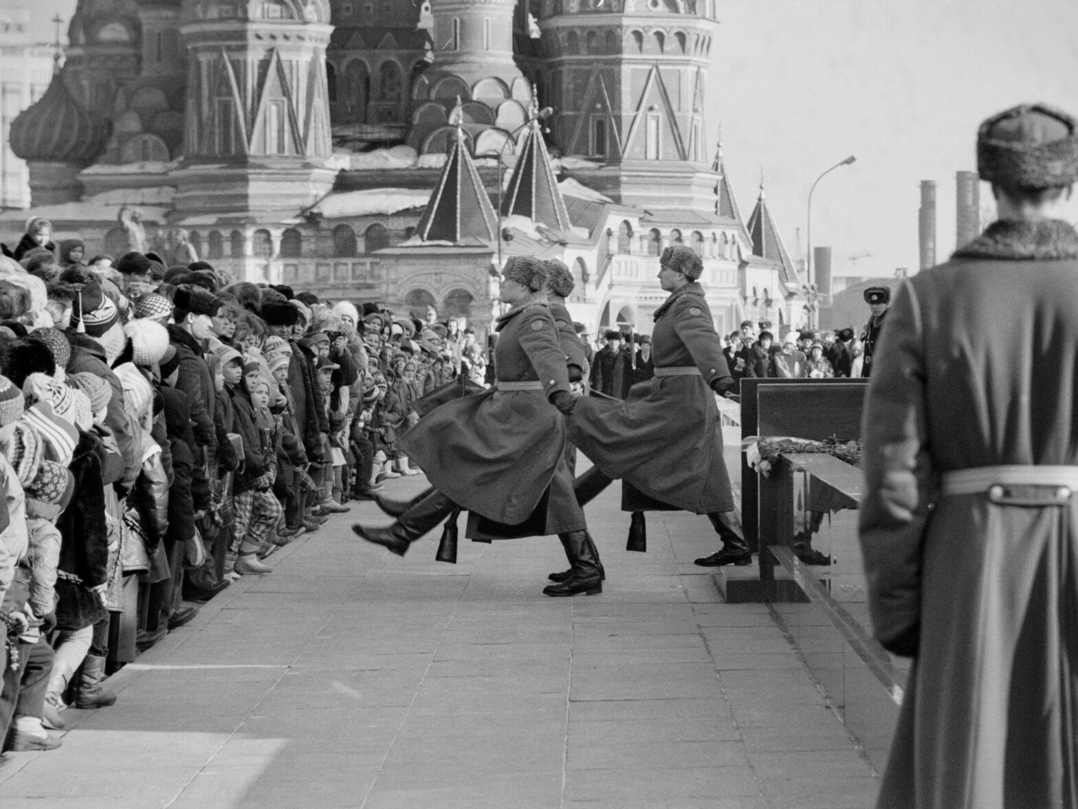 A crowd watches the hourly changing of the honor guard at Lenin's mausoleum in Red Square