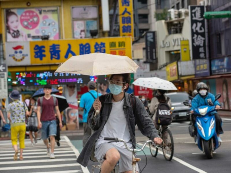 A cyclist wearing a mask near the National Taiwan University in Taipei