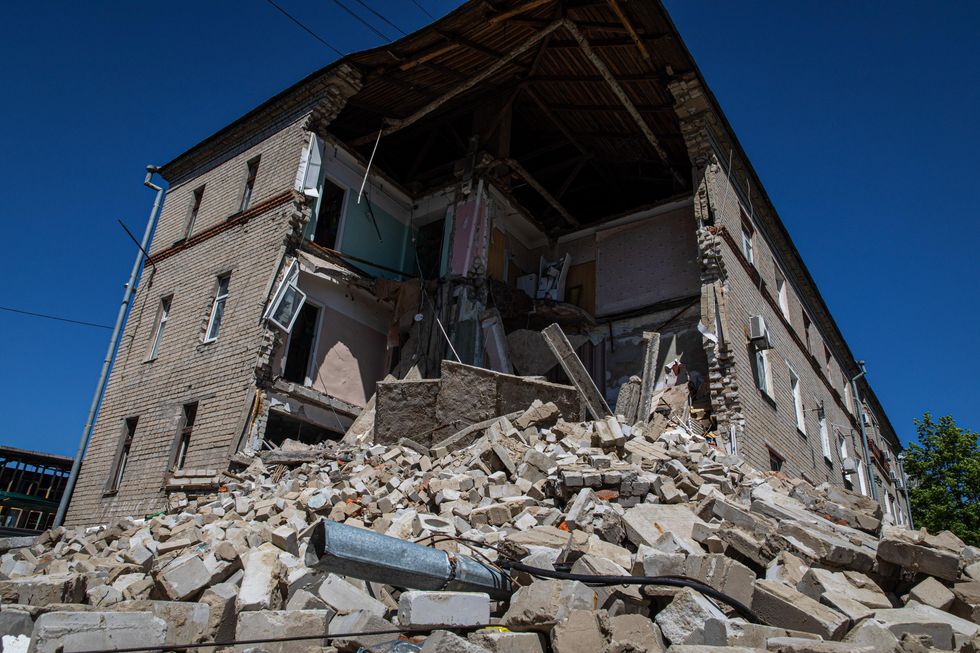 A destroyed residential building seen in Kharkiv