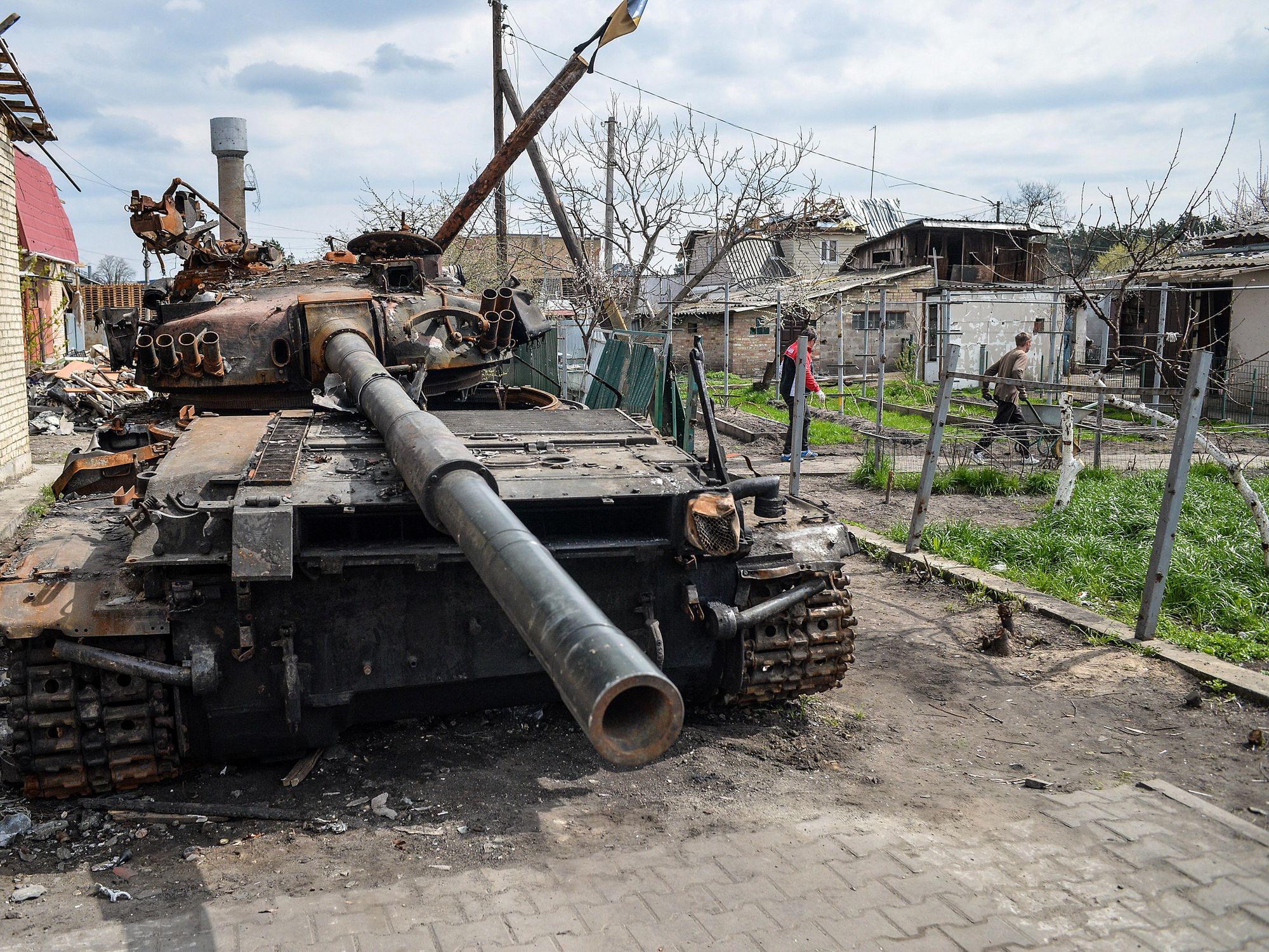 A destroyed Russian tank remains in the yard of a private house in Hostomel, Ukraine​